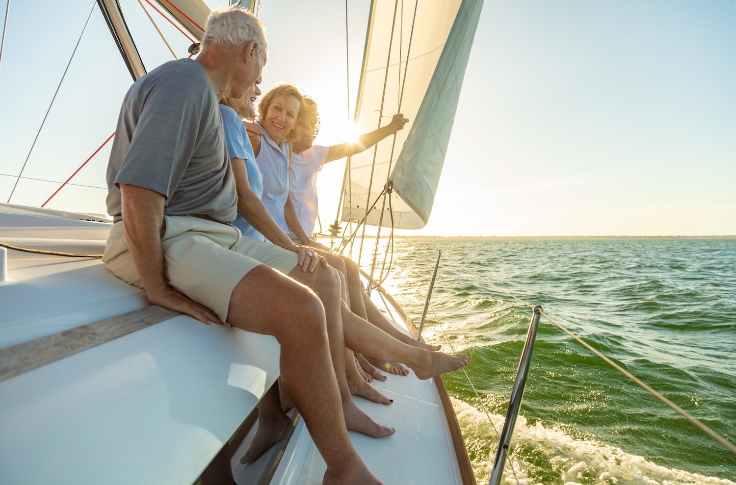 group of senior friends on sailboat