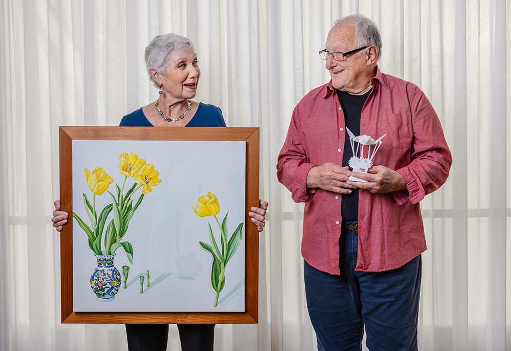 Sheila & Jerry holding their artwork