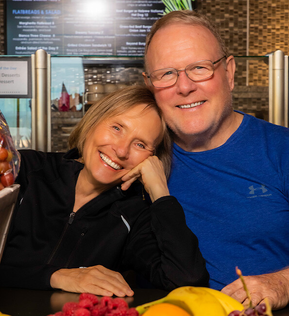 Judy and Dennis smiling at the camera