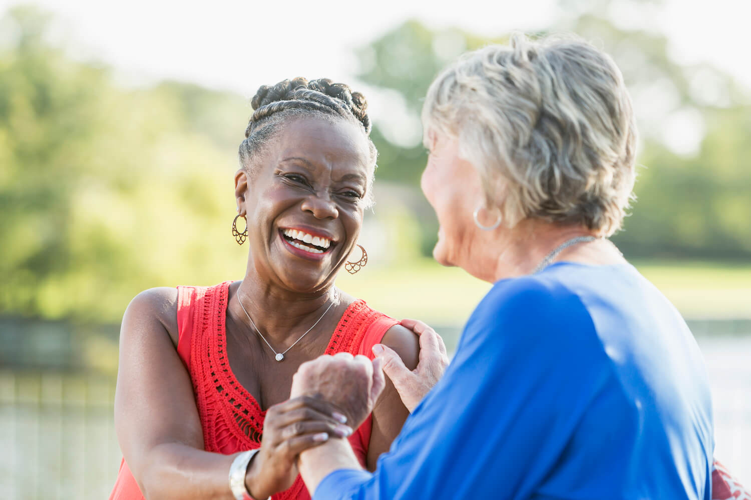 Two women smiling at each other